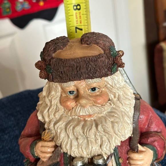 Hunting Santa carries his binoculars and hunting equipment wearing a furry hat - Picture 8 of 8